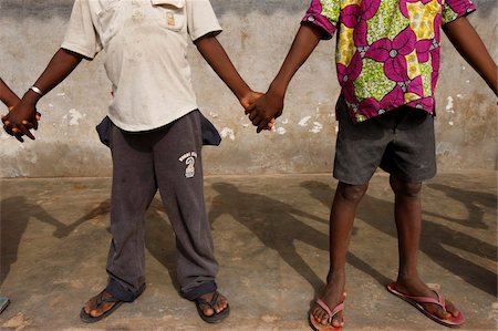 simsearch:841-06032301,k - African schoolchildren holding hands, Lome, Togo, West Africa, Africa Fotografie stock - Rights-Managed, Codice: 841-05785852