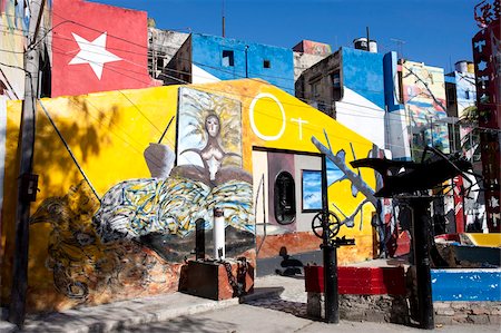 Buildings painted in colourful Afro-Cuban art, masterminded by artist Salvador Gonzalez Escalona, Callejon de Hamel, Havana, Cuba, West Indies, Central America Stock Photo - Rights-Managed, Code: 841-05781379