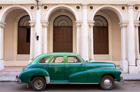 Classic green American car parked outside The National Ballet School, Havana, Cuba, West Indies, Central America Stock Photo - Rights-Managed, Code: 841-05781372