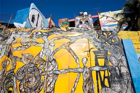 Buildings painted in colourful Afro-Cuban art, masterminded by artist Salvador Gonzalez Escalona, Callejon de Hamel, Havana, Cuba, West Indies, Central America Stock Photo - Rights-Managed, Code: 841-05781381