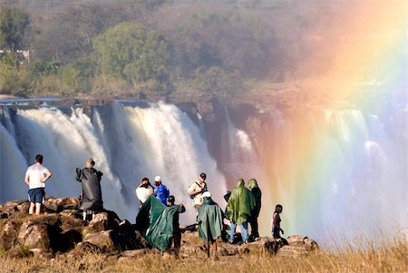 Tourists viewing Victoria Falls, UNESCO World Heritage Site, Zimbabwe, Africa Foto de stock - Con derechos protegidos, Código: 841-05781768