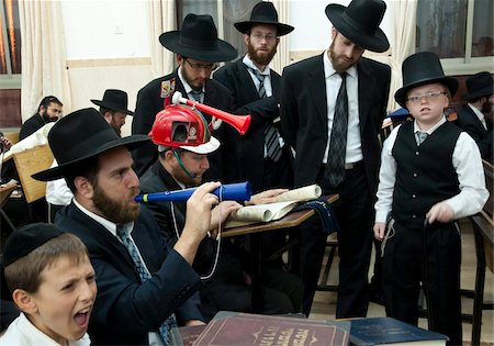 simsearch:841-06344088,k - When Haman's name is read out during the public chanting of the Megillah in the synagogue, which occurs 54 times, the congregation engages in noisemaking to blot out his name, Purim Festival, Ramat Beit Shemesh, Israel, Middle East Stock Photo - Rights-Managed, Code: 841-05781895