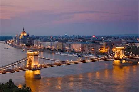 szechenyi chain bridge - Panorama of the city at sunset with the Hungarian Parliament building, and the Chain bridge (Szechenyi Lanchid), over the River Danube, UNESCO World Heritage Site, Budapest, Hungary, Europe Stock Photo - Rights-Managed, Code: 841-05782269