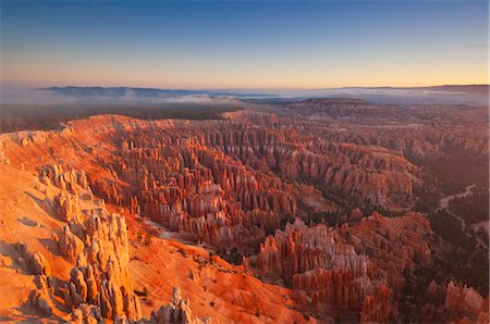 Sandstone hoodoos in Bryce Amphitheater, sunrise with low mist, Bryce Canyon National Park, Utah, United States of America, North America Stock Photo - Rights-Managed, Code: 841-05782359