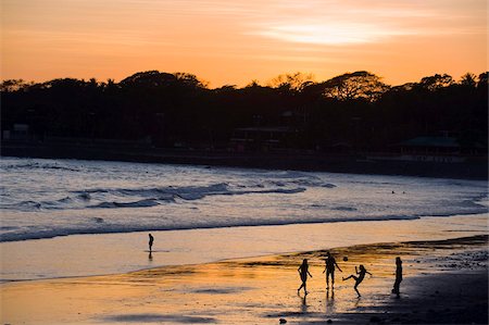 People playing football on the beach at La Libertad, Pacific Coast, El Salvador, Central America Stock Photo - Rights-Managed, Code: 841-05782528