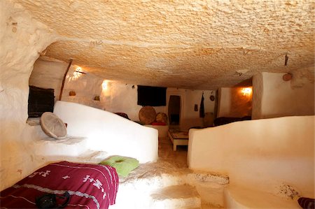 Hotel (gite) room inside a ghorfa at hillside Berber village of Chenini, Tunisia, North Africa, Africa Fotografie stock - Rights-Managed, Codice: 841-05794639