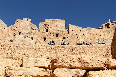 Troglodyte cave dwellings and local workers using donkeys, hillside Berber village of Chenini, Tunisia, North Africa, Africa Stock Photo - Rights-Managed, Code: 841-05794644