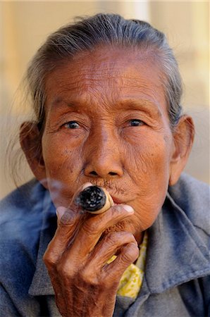 simsearch:841-07202444,k - Old woman smokes a marihuana cigar, Bagan, Myanmar, Asia Stock Photo - Rights-Managed, Code: 841-05794778