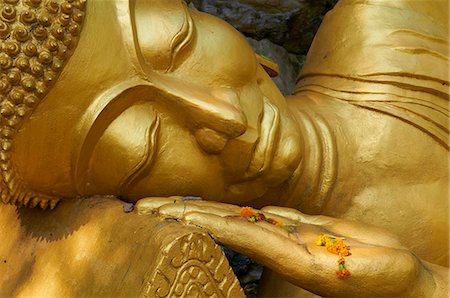 sleep buddha - Detail of statue of Buddha, Phu Si Hill, Luang Prabang, UNESCO World Heritage Site, Laos, Indochina, Southeast Asia, Asia Stock Photo - Rights-Managed, Code: 841-05796408