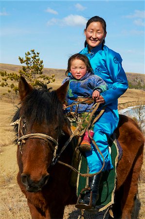 portrait photography with girls and horses - Young Mongolian woman and child in traditional costume (deel) riding a horse, Province of Khovd, Mongolia, Central Asia, Asia Stock Photo - Rights-Managed, Code: 841-05796518