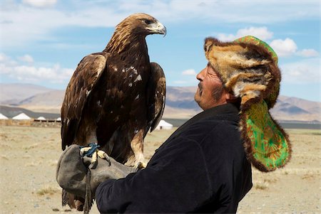 Kazakh hunter with his eagle, Region of Bayan Ulgii, Mongolia, Central Asia, Asia Stock Photo - Rights-Managed, Code: 841-05796528