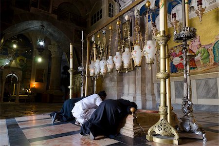 Pilgrims kneeling at the stone of anointing, Holy Sepulchre, Old City, Jerusalem, Israel, Middle East Stock Photo - Rights-Managed, Code: 841-05846122