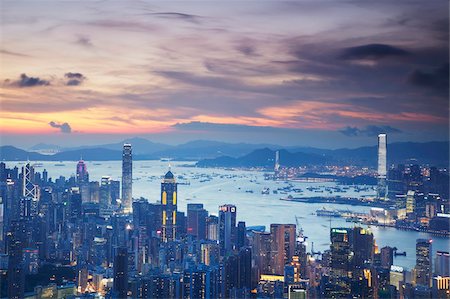 skyline from above night - Hong Kong Island and Kowloon skylines at sunset, Hong Kong, China, Asia Stock Photo - Rights-Managed, Code: 841-05846442