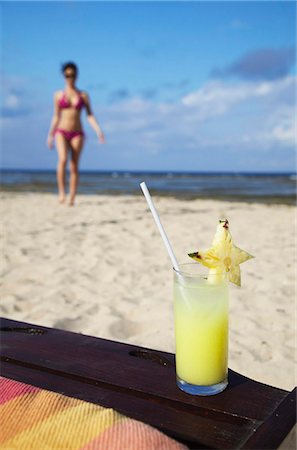 Woman and tropical drink on beach, Sanur, Bali, Indonesia, Southeast Asia, Asia Stock Photo - Rights-Managed, Code: 841-05846479