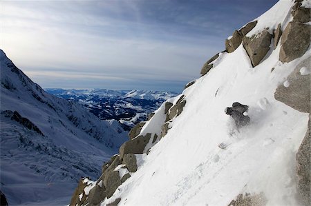 snowboarder powder snow - A snowboarder tackles a challenging off piste descent on Mont Blanc, Chamonix, Haute Savoie, French Alps, France, Europe Stock Photo - Rights-Managed, Code: 841-05846612