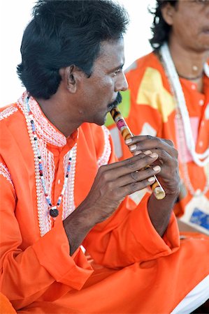 simsearch:841-06031266,k - Hindu musician dressed in orange clothing playing ten scale Indian harmonium keyboard, West Bengal, India, Asia Stock Photo - Rights-Managed, Code: 841-05846633
