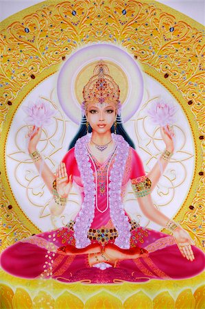 Picture of Lakshmi, goddess of wealth and consort of Lord Vishnu, sitting holding lotus flowers, Haridwar, Uttarakhand, India, Asia Stock Photo - Rights-Managed, Code: 841-05846907