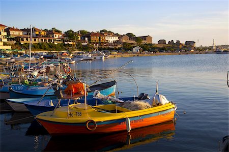 Fishing boats and view towards ramparts and ruins of the medieval fortification walls, Nessebar, Black Sea, Bulgaria, Europe Stock Photo - Rights-Managed, Code: 841-05847098