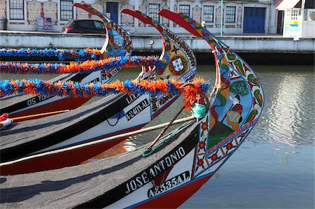 The prows of gondola-like Moliceiros, boats used to give tourists rides along the canals of Aveiro, Beira Litoral, Portugal, Europe Stock Photo - Rights-Managed, Code: 841-05847161
