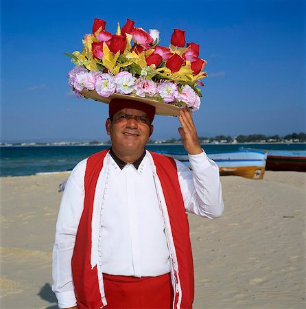 Flower seller on the beach, Hammamet, Cap Bon, Tunisia, North Africa, Africa Foto de stock - Con derechos protegidos, Código: 841-05848518