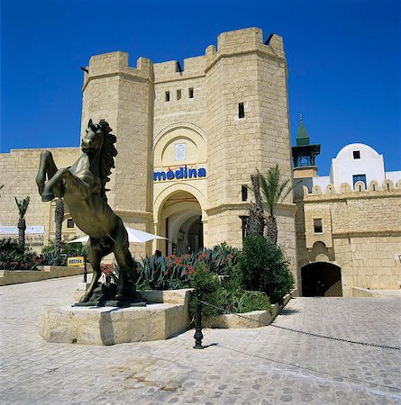 Gateway entrance of the Medina shopping and restaurant complex, Yasmine Hammamet, Cap Bon, Tunisia, North Africa, Africa Stock Photo - Rights-Managed, Code: 841-05848525