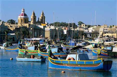 simsearch:841-06032816,k - View across harbour with traditional Luzzu fishing boats, Marsaxlokk, Malta, Mediterranean, Europe Stock Photo - Rights-Managed, Code: 841-05848562