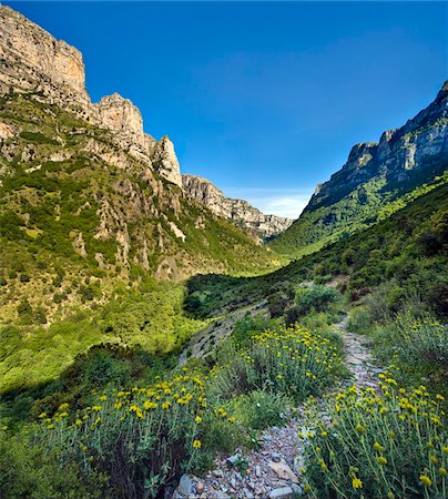 Looking back along the Vikos Gorge footpath in springtime, underneath the village of Vikos, with the Astaka peaks above, Epirus, Greece, Europe Stock Photo - Rights-Managed, Code: 841-05848811