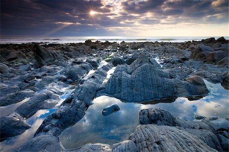 sandymouth bay - Rock pools and eroded rocks ledges at Sandymouth Bay in North Cornwall, England, United Kingdom, Europe Stock Photo - Rights-Managed, Code: 841-05962457
