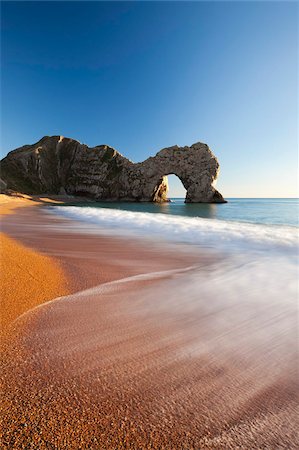 Waves break onto Durdle Door beach in winter, Jurassic Coast, UNESCO World Heritage Site, Dorset, England, United Kingdom, Europe Stock Photo - Rights-Managed, Code: 841-05962617