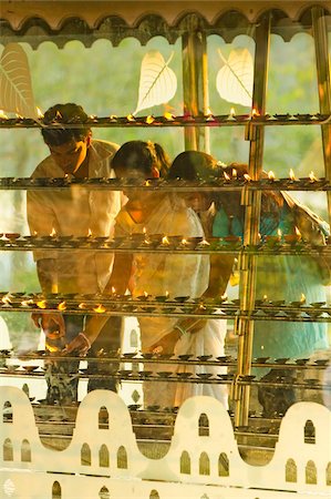 Devotees lighting candles at sunset in the Temple of the Sacred Tooth Relic (Temple of the Tooth), site of Buddhist pilgrimage, Kandy, Sri Lanka, Asia Stock Photo - Rights-Managed, Code: 841-05962848