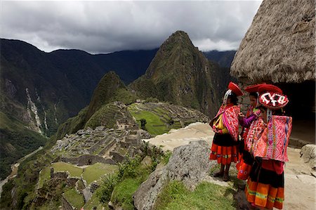 peru - Traditionally dressed children looking over the ruins of the Inca city of Machu Picchu, UNESCO World Heritage Site, Vilcabamba Mountains, Peru, South America Stock Photo - Rights-Managed, Code: 841-06034484