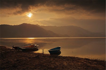 simsearch:700-06009366,k - Local fishing boats on Phewa Lake at sunset, Gandak, Nepal, Asia Stock Photo - Rights-Managed, Code: 841-06030808