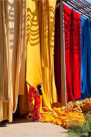 simsearch:841-07540446,k - Woman in sari checking the quality of freshly dyed fabric hanging to dry, Sari garment factory, Rajasthan, India, Asia Stock Photo - Rights-Managed, Code: 841-06031281