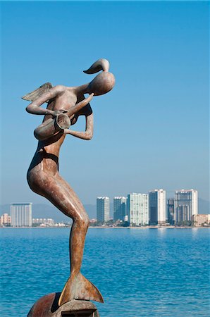 Mermaid Angel Playing Saxophone sculpture on the Malecon, Puerto Vallarta, Jalisco, Mexico, North America Foto de stock - Con derechos protegidos, Código: 841-06031500