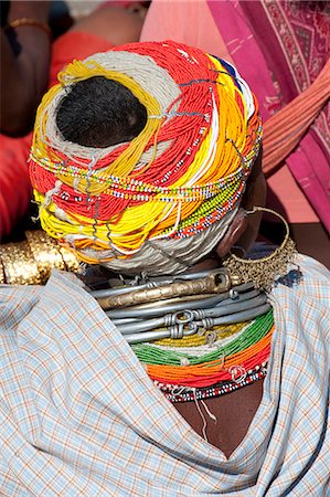 Head of Bonda tribeswoman wearing traditional beaded cap held with metal clips, large earrings and metal and bead necklaces, Rayagader, Orissa, India, Asia Stock Photo - Rights-Managed, Code: 841-06031726