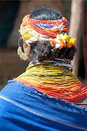 Bonda tribeswoman wearing blue cotton shawl over traditional bead costume, with beaded cap, large earrings and metal necklaces, Rayagader, Orissa, India, Asia Stock Photo - Rights-Managed, Code: 841-06031740