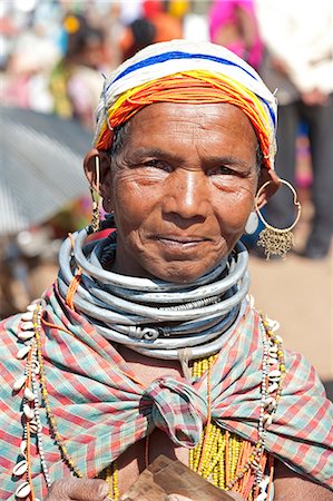 Smiling Bonda tribeswoman wearing cotton shawl over traditional bead costume, beaded cap, large earrings and metal necklaces, Rayagader, Orissa, India, Asia Foto de stock - Con derechos protegidos, Código: 841-06031742