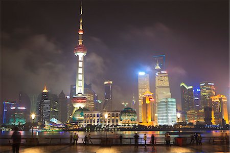 shanghai - Pudong skyline at night across the Huangpu River, Oriental Pearl tower on left, Shanghai, China, Asia Stock Photo - Rights-Managed, Code: 841-06031934