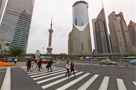 Pedestrian crossing in Pudong, the financial and business centre. Oriental Pearl Tower in centre, Shanghai, China, Asia Stock Photo - Rights-Managed, Code: 841-06031986