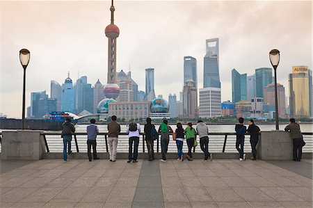 People viewing the Pudong skyline and the Oriental Pearl Tower from the Bund, Shanghai, China, Asia Stock Photo - Rights-Managed, Code: 841-06032035