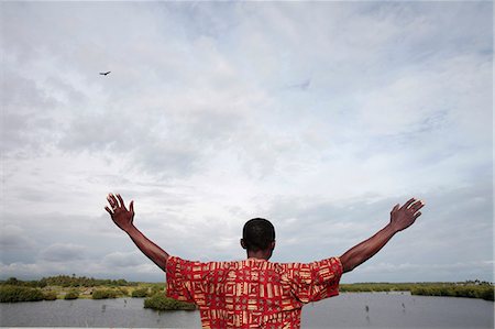 Homme africain, je regarde le ciel, Ouidah, Bénin, Afrique de l'Ouest, l'Afrique Photographie de stock - Rights-Managed, Code: 841-06032118