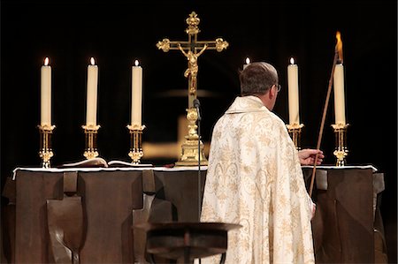 priest - Altar candle lighting at Notre-Dame de Paris cathedral, Paris, France, Europe Stock Photo - Rights-Managed, Code: 841-06032147