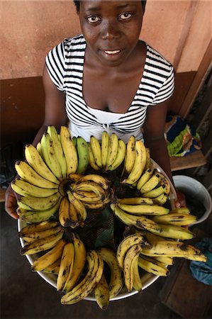 Girl selling bananas, Lome, Togo, West Africa, Africa Fotografie stock - Rights-Managed, Codice: 841-06032409