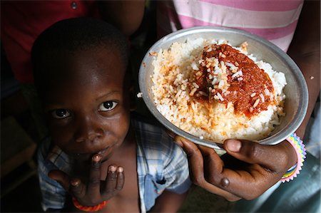 simsearch:841-06032425,k - Children eating an African meal, Lome, Togo, West Africa, Africa Stock Photo - Rights-Managed, Code: 841-06032403
