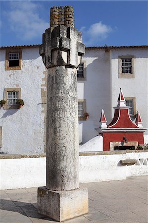 portugal pillar - Inscribed column at the entrance gate to the medieval walled city of Obidos, Estremadura, Portugal, Europe Stock Photo - Rights-Managed, Code: 841-06032586