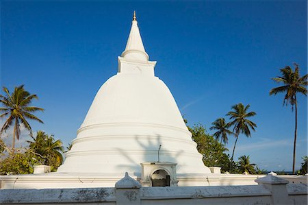 Stupa (dagoba) at a small Buddhist temple overlooking the south coast at Mirissa, near Matara, Southern Province, Sri Lanka, Asia Stock Photo - Rights-Managed, Code: 841-06032756