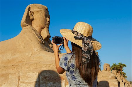 Tourist taking a photo on the Sphinx path, Temple of Luxor, Luxor, Thebes, UNESCO World Heritage Site, Egypt, North Africa, Africa Stock Photo - Rights-Managed, Code: 841-06032893