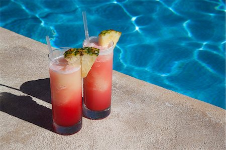 swimming pool nobody outdoor day - Colourful cocktails by the pool, Punta Cana, Dominican Republic, West Indies, Caribbean, Central America Stock Photo - Rights-Managed, Code: 841-06033125