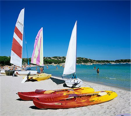 sailboat on the beach - Watersports on beach, Plage de Santa Giulia, southeast coast, Corsica, France, Mediterranean, Europe Stock Photo - Rights-Managed, Code: 841-06033733