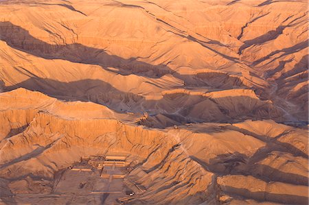 Aerial view from hot air balloon of Hatshepsut's Mortuary Temple at Deir el-Bahri, and the Valley of the Kings at sunrise, Thebes, UNESCO World Heritage Site, Egypt, North Africa, Africa Stock Photo - Rights-Managed, Code: 841-06033880